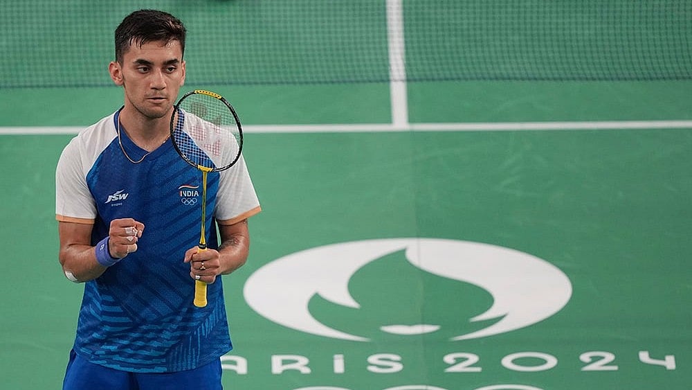 | Photo: AP/Kin Cheung : Lakshya Sen celebrates after defeating Jonatan Christie 